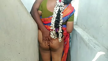 A Tamil aunty with long hair engages in sexual activity with a servant boy in the bedroom